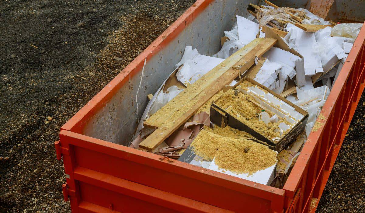 Full dumpster with construction debris.