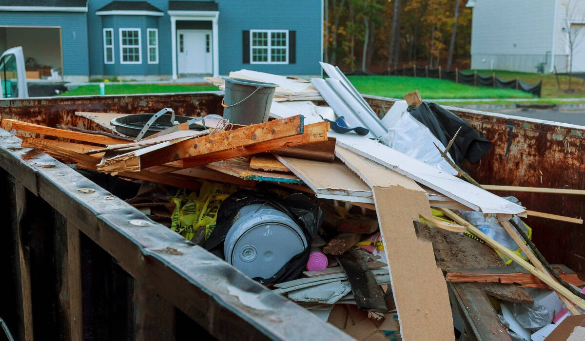 Overflowing dumpster filled with construction debris